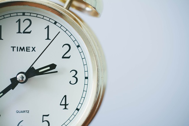 IPM102 Course Image: Close up image of alarm clock with white face, off centre to the left depecting the start of a project