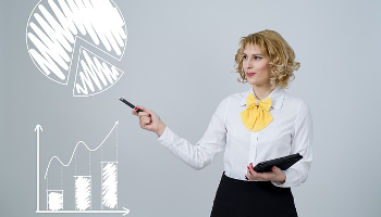 IENT101 Course Image: Image of female entrepreneur depicting presentation using a bar and pie chart